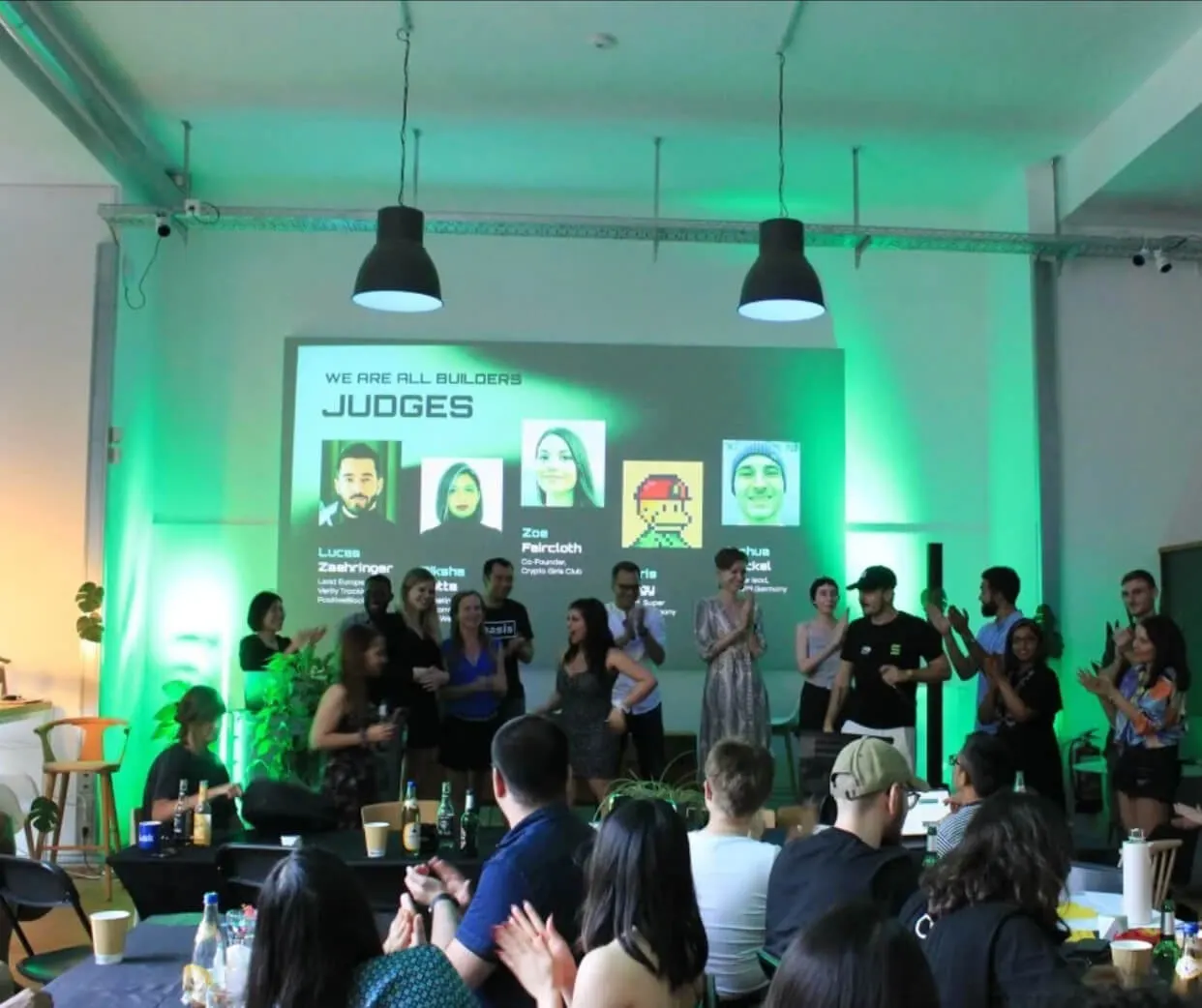 Hackathon judges and builders at a Solana Impact event